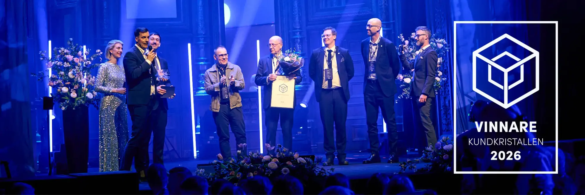 ABK:s representanter tar emot pris på eventet